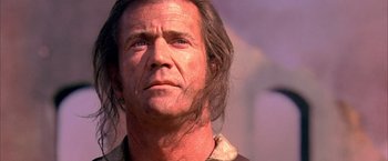 Movie still from “The Patriot” (2000), directed by Roland Emmerich – A person with long hair; Close Up shot, Low angle