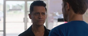 Movie still from “Breaking News in Yuba County” (2021), directed by Tate Taylor – A person wearing a black shirt; Close Up shot, Over the shoulder angle