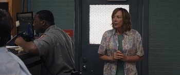 Movie still from “Breaking News in Yuba County” (2021), directed by Tate Taylor – A woman standing in front of a man; Medium shot, Over the shoulder angle