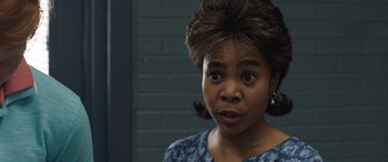 Movie still from “Breaking News in Yuba County” (2021), directed by Tate Taylor – A person wearing a blue shirt; Close Up shot, Over the shoulder angle