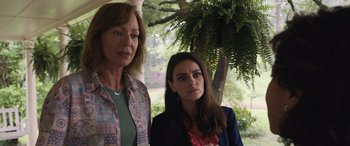 Movie still from “Breaking News in Yuba County” (2021), directed by Tate Taylor – Two women standing next to each other near a tree; Medium shot, Over the shoulder angle