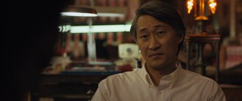 Movie still from “Breaking News in Yuba County” (2021), directed by Tate Taylor – A person wearing a white shirt; Close Up shot, Over the shoulder angle