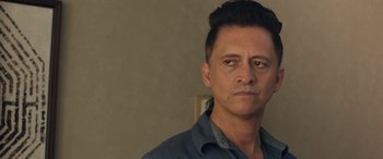 Movie still from “Breaking News in Yuba County” (2021), directed by Tate Taylor – A person wearing a blue shirt; Close Up shot, Over the shoulder angle