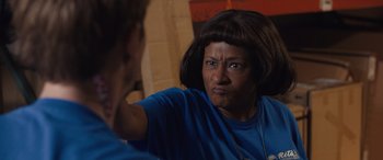 Movie still from “Breaking News in Yuba County” (2021), directed by Tate Taylor – An older woman looking into a mirror with an angry look on her face; Close Up shot, Over the shoulder angle