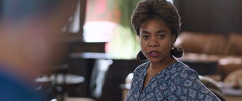 Movie still from “Breaking News in Yuba County” (2021), directed by Tate Taylor – An older woman is looking at the camera; Close Up shot, Over the shoulder angle