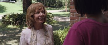 Movie still from “Breaking News in Yuba County” (2021), directed by Tate Taylor – An older woman talking to a younger woman outside; Close Up shot, Over the shoulder angle