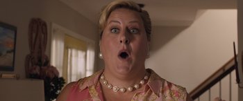 Movie still from “Breaking News in Yuba County” (2021), directed by Tate Taylor – A person wearing a necklace; Close Up shot, Low angle