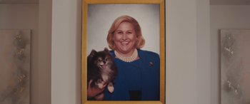 Movie still from “Breaking News in Yuba County” (2021), directed by Tate Taylor – A portrait of a woman holding a dog in her arms; Close Up shot, High angle