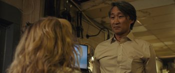 Movie still from “Breaking News in Yuba County” (2021), directed by Tate Taylor – A man and a woman are talking in a room; Medium shot, Over the shoulder angle