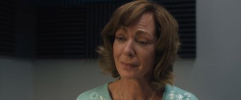 Movie still from “Breaking News in Yuba County” (2021), directed by Tate Taylor – An older woman is looking down at her face; Close Up shot, Over the shoulder angle