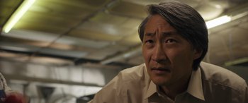 Movie still from “Breaking News in Yuba County” (2021), directed by Tate Taylor – An older man with a gray hair and a brown shirt; Close Up shot, Low angle