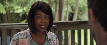 Movie still from “Breaking News in Yuba County” (2021), directed by Tate Taylor – A person with short black hair; Close Up shot, Over the shoulder angle