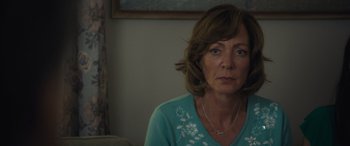 Movie still from “Breaking News in Yuba County” (2021), directed by Tate Taylor – A person sitting in a room; Close Up shot, Over the shoulder angle