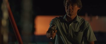 Movie still from “Breaking News in Yuba County” (2021), directed by Tate Taylor – A man holding a video game controller in his hand; Close Up shot, Low angle