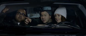 Movie still from “Broken” (2021), directed by Patrick Phillips – A man and a woman in the back seat of a car; Close Up shot, Over the shoulder angle