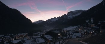 Movie still from “Broken” (2021), directed by Patrick Phillips – A view of a town with a mountain in the background; Extreme Wide shot, High angle