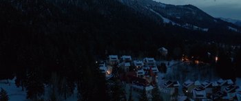 Movie still from “Broken” (2021), directed by Patrick Phillips – A view of a ski resort at night from above; Extreme Wide shot, High angle