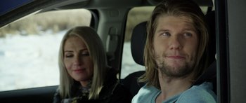Movie still from “Broken” (2021), directed by Patrick Phillips – A man and a woman sitting in the back of a car; Close Up shot, Over the shoulder angle