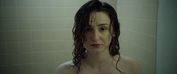 Movie still from “Broken” (2021), directed by Patrick Phillips – A woman with wet hair in a bathroom; Close Up shot, Over the shoulder angle
