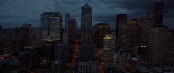 Movie still from “Broken” (2021), directed by Patrick Phillips – A view of a city at night from above; Extreme Wide shot, High angle