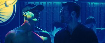 Movie still from “Bros” (2022), directed by Nicholas Stoller – A man and a woman are talking in a room; Close Up shot, Over the shoulder angle