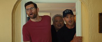 Movie still from “Bros” (2022), directed by Nicholas Stoller – A group of men standing next to each other; Medium shot, Over the shoulder angle