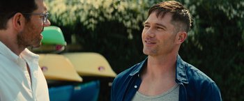 Movie still from “Bros” (2022), directed by Nicholas Stoller – A person wearing a blue shirt; Close Up shot, Over the shoulder angle