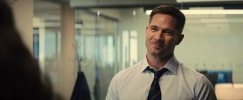 Movie still from “Bros” (2022), directed by Nicholas Stoller – A person wearing a shirt and a tie; Close Up shot, Over the shoulder angle