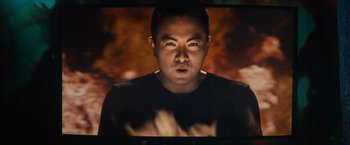 Movie still from “Bros” (2022), directed by Nicholas Stoller – A person in a black shirt; Medium shot, Low angle