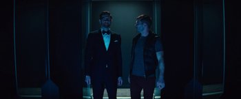 Movie still from “Bros” (2022), directed by Nicholas Stoller – A couple of men standing next to each other; Medium shot, Low angle