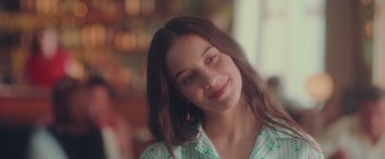 Movie still from “Burning Patience” (2022), directed by Rodrigo Sepúlveda – A person with long brown hair; Close Up shot, Over the shoulder angle