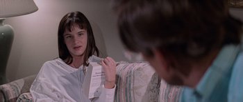 Movie still from “Cape Fear” (1991), directed by Martin Scorsese – A woman sitting in front of another woman holding a book; Medium shot, Over the shoulder angle