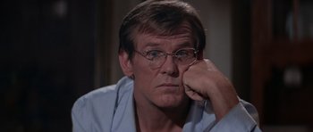 Movie still from “Cape Fear” (1991), directed by Martin Scorsese – A person wearing glasses; Close Up shot, Over the shoulder angle