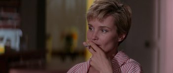 Movie still from “Cape Fear” (1991), directed by Martin Scorsese – A person with a cigarette in her mouth; Close Up shot, Over the shoulder angle