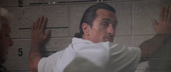 Movie still from “Cape Fear” (1991), directed by Martin Scorsese – A person with a towel; Close Up shot, Low angle