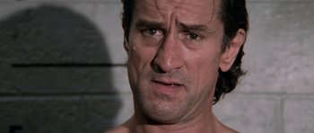 Movie still from “Cape Fear” (1991), directed by Martin Scorsese – A person with his eyes wide open; Close Up shot, Over the shoulder angle