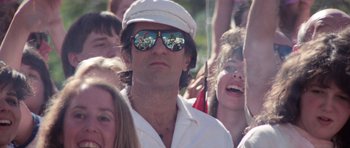 Movie still from “Cape Fear” (1991), directed by Martin Scorsese – A group of young people standing next to each other wearing sunglasses; Close Up shot, Low angle