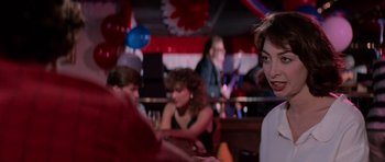 Movie still from “Cape Fear” (1991), directed by Martin Scorsese – A group of people sitting at a table in a room; Close Up shot, Over the shoulder angle