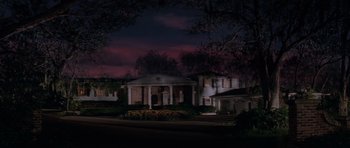 Movie still from “Cape Fear” (1991), directed by Martin Scorsese – A large white house in the dark at night; Extreme Wide shot, Low angle