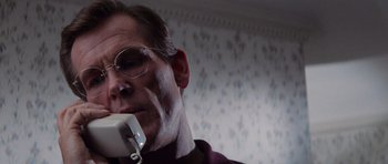 Movie still from “Cape Fear” (1991), directed by Martin Scorsese – A person talking on a phone; Close Up shot, Low angle