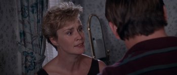 Movie still from “Cape Fear” (1991), directed by Martin Scorsese – A woman looking at a man in the mirror; Close Up shot, Over the shoulder angle