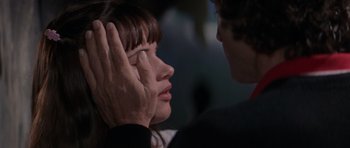 Movie still from “Cape Fear” (1991), directed by Martin Scorsese – A man touching a woman's face with her hand; Close Up shot, Over the shoulder angle