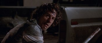 Movie still from “Cape Fear” (1991), directed by Martin Scorsese – A person with curly brown hair; Close Up shot, Low angle