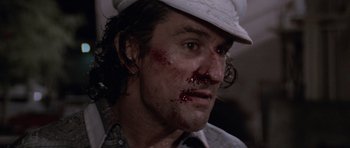 Movie still from “Cape Fear” (1991), directed by Martin Scorsese – A person with blood on his face; Close Up shot, Low angle
