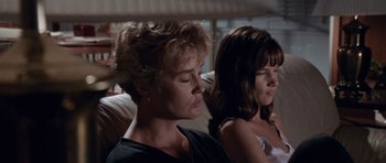 Movie still from “Cape Fear” (1991), directed by Martin Scorsese – A woman and a young girl sitting next to each other on a couch; Close Up shot, Low angle