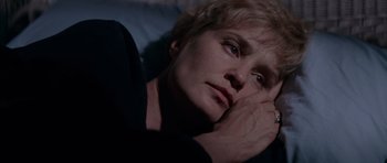 Movie still from “Cape Fear” (1991), directed by Martin Scorsese – A person laying on a bed; Close Up shot, High angle