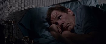 Movie still from “Cape Fear” (1991), directed by Martin Scorsese – A person laying in a bed; Close Up shot, High angle