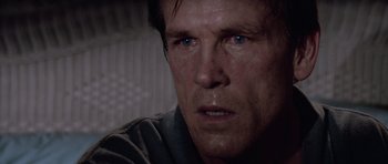 Movie still from “Cape Fear” (1991), directed by Martin Scorsese – A man's face in a dark room; Close Up shot, Low angle