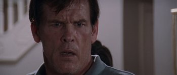 Movie still from “Cape Fear” (1991), directed by Martin Scorsese – A man's face in a dark room; Close Up shot, Over the shoulder angle