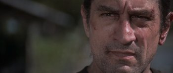 Movie still from “Cape Fear” (1991), directed by Martin Scorsese – A man's face with a lot of dirt on it; Close Up shot, Low angle